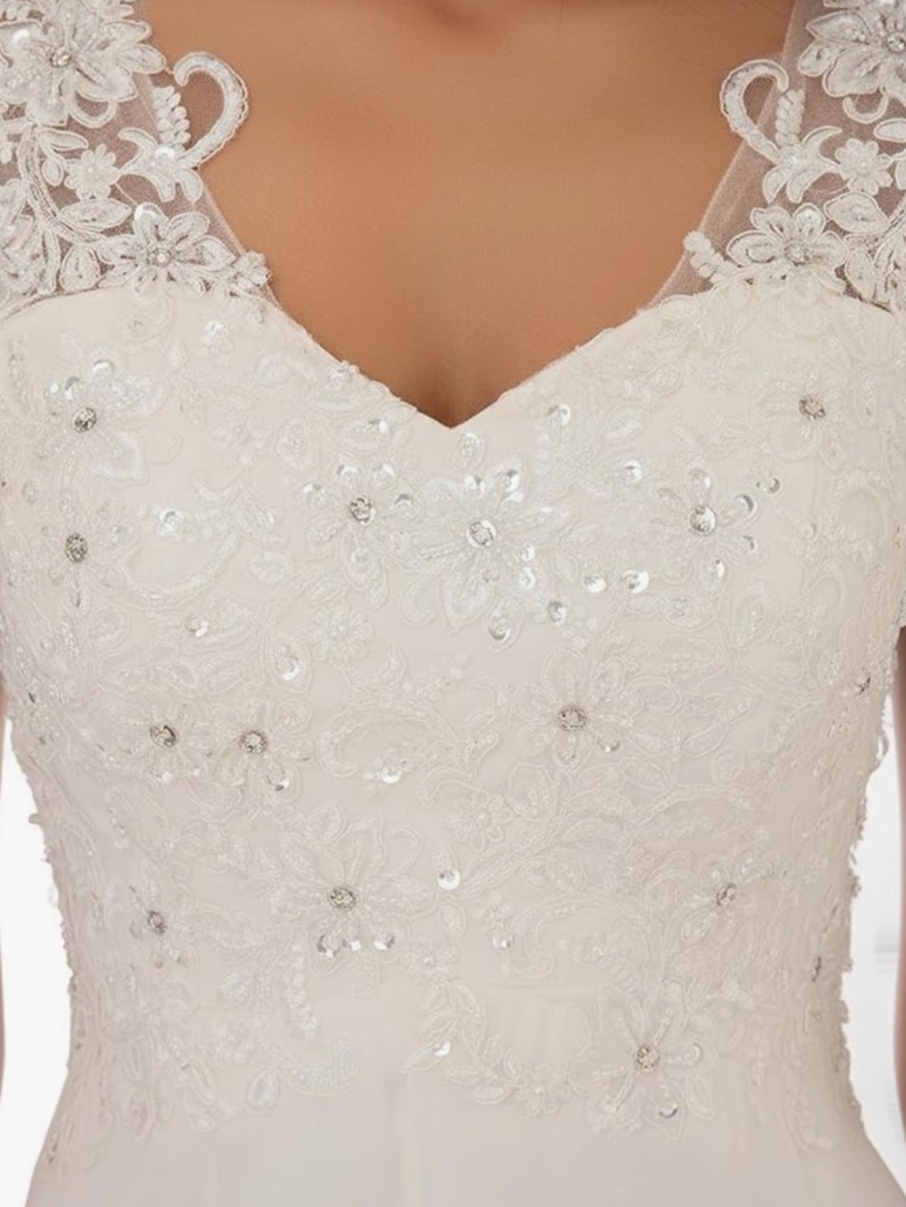A timeless ivory dress with delicate lace appliqué and subtle beadwork on the bo - Picture 2 of 4